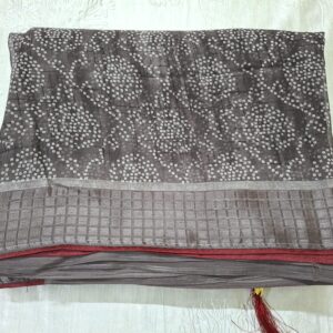 Black bandhani saree with silk border and contrast blouse